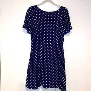 Navy blue with white polka dot flowy cap sleeve with lower cut back and zipper